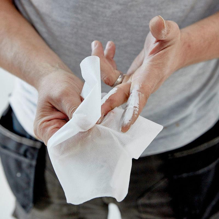 Using Soudal Swipex Wipes to clean hands effectively, removing uncured sealants, adhesives, and grime for a spotless finish. Ideal for professional or DIY tasks.