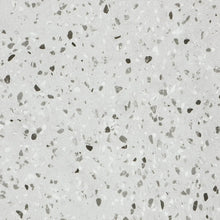 Close-up of a gray terrazzo pattern with small colored chips.