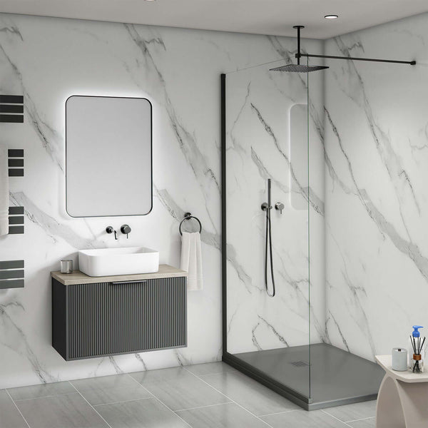 A modern bathroom featuring a freestanding white bath in front of white marble matt bathroom wall panels with soft grey veining. Natural lighting and soft shadows highlight the realistic stone texture of the shower panels, making this a stylish and practical example of shower cladding as a tile alternative