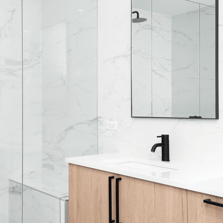 Bright and modern bathroom featuring White Marble panels, offering a sleek and timeless marble effect. Perfect for creating a sophisticated and clean space.
